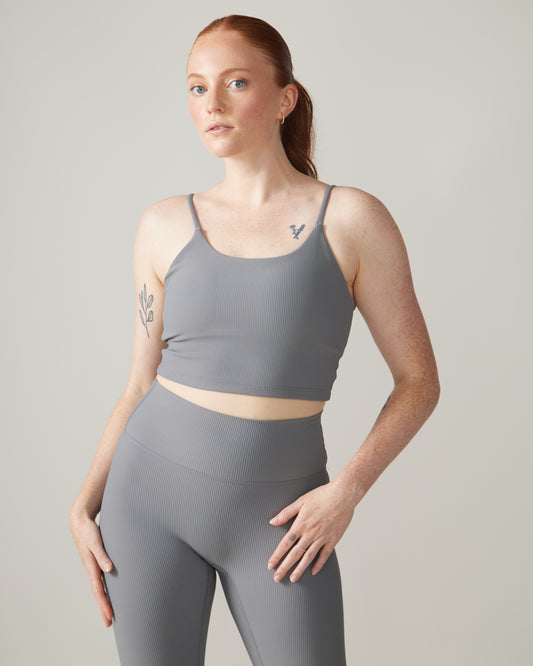 Women wearing the North Star Rib Soft Compression Sports Bra by Rose Boreal - Stone Grey / Femme qui porte le soutien-gorge côtelé étoile du nord de Rose Boreal - Galet.